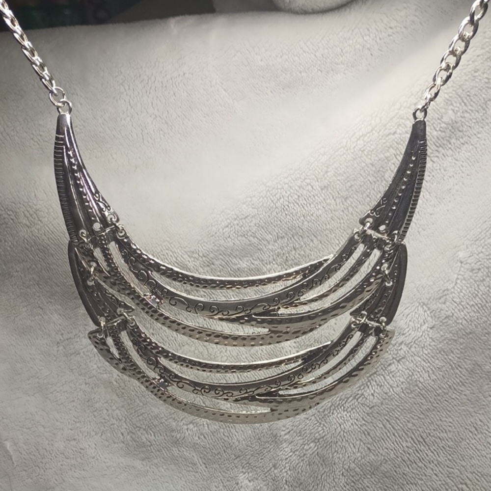 Silver Multi-Tiered Crescent Necklace with Textured Bars